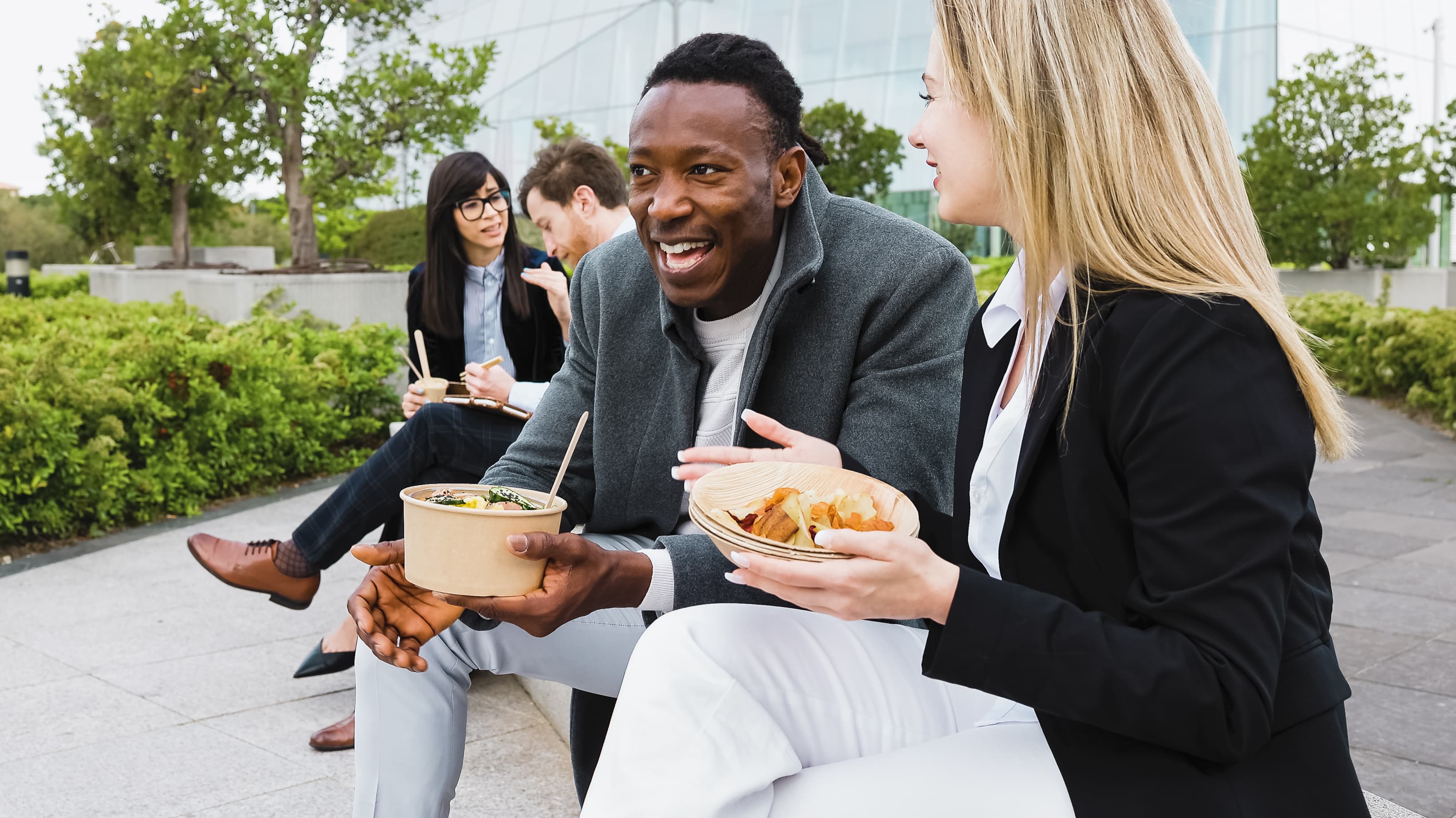 Team enjoying fresh food outside the workplace